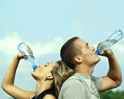 people drinking a bottle of water